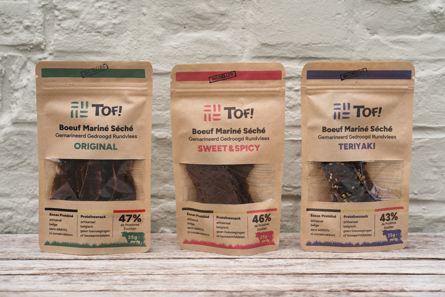 Packshot des trois saveurs uniques de beef jerky artisanal belge de la marque Tof: original, teriyaki et sweet & spicy